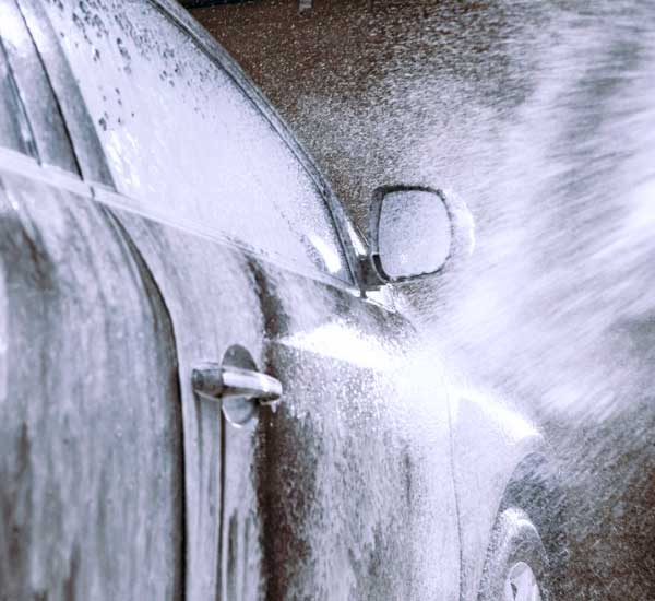 car being sprayed with foam