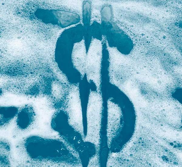 Dollar sign made out of bubbles on a car window