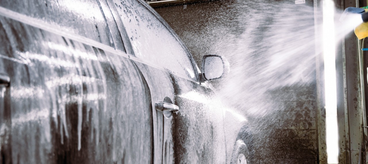 Black car in a car wash