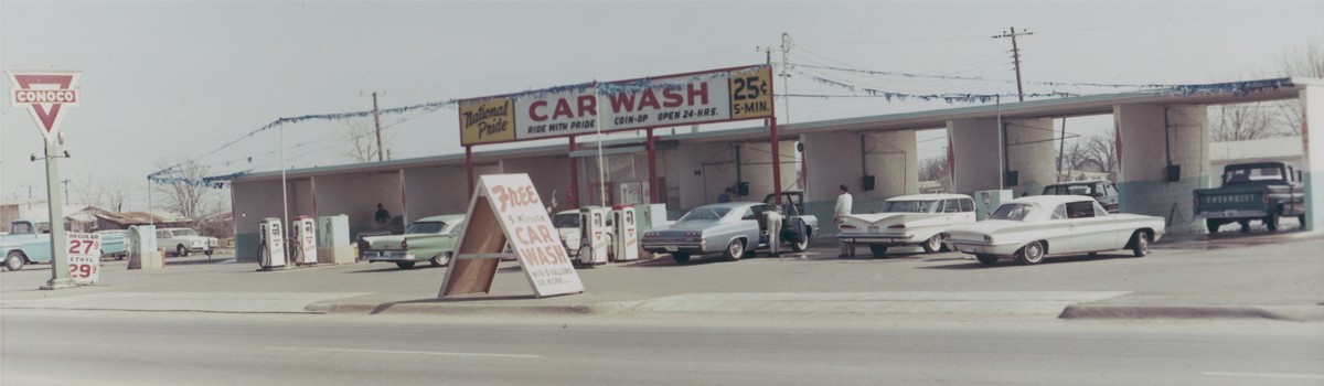 Self service car wash in the 1970s with a sign that says 25cents