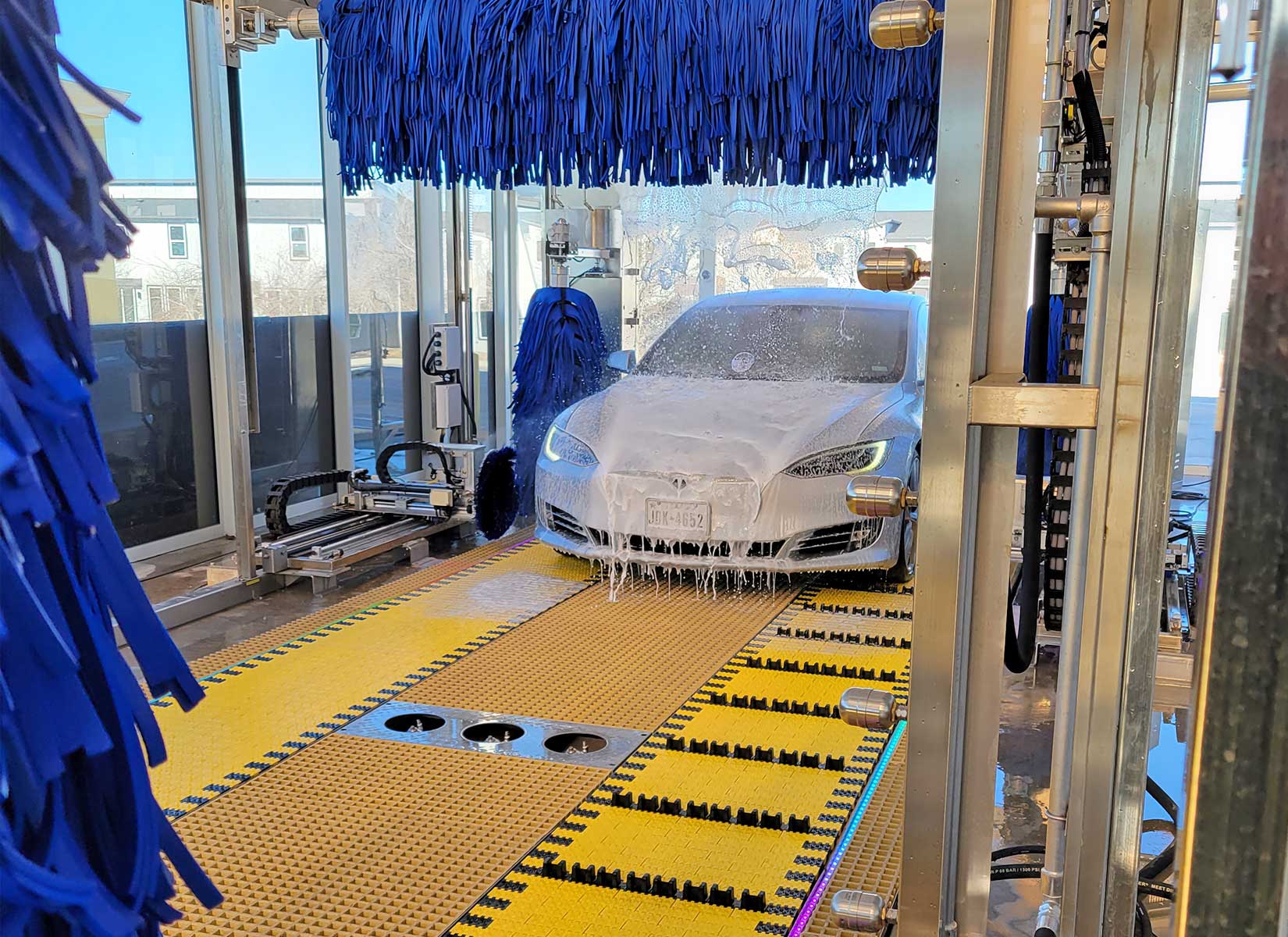 white car in a ModBrite car wash