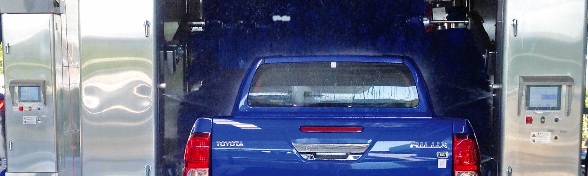 blue truck inside of the TouchBrite car wash