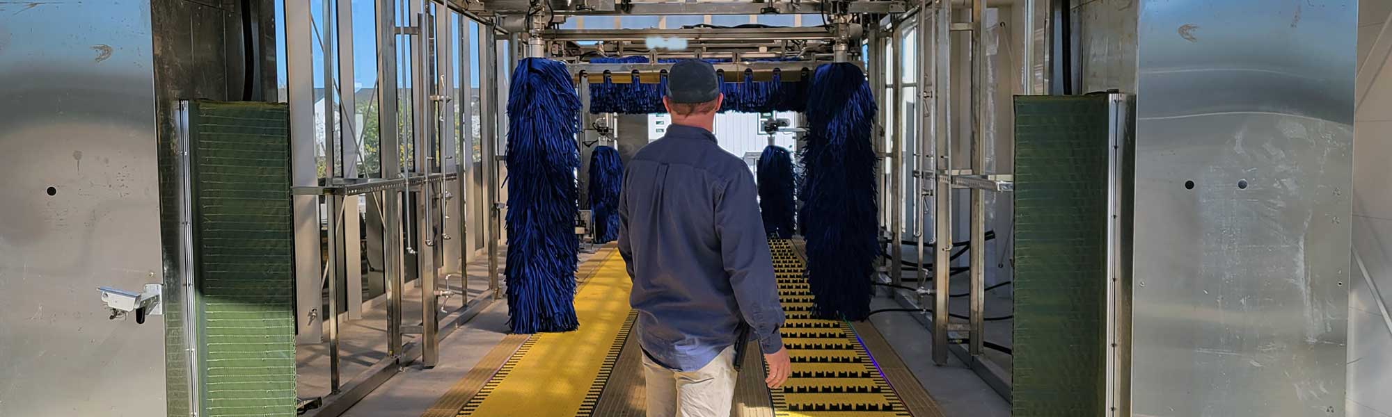 Man standing in car wash