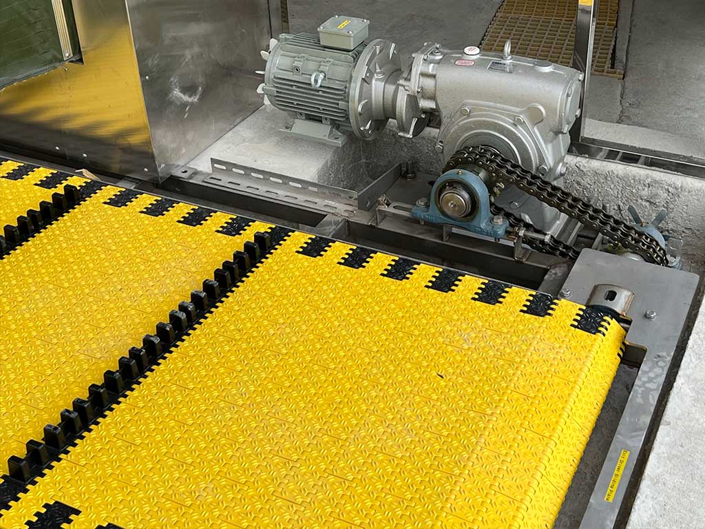 Close up shot of a conveyor belt and chain