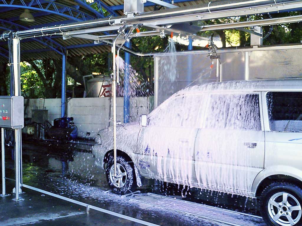 Self service car wash with a mini van in it